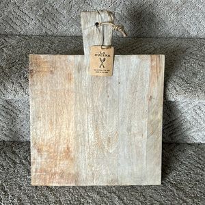 Brand new cutting/serving board with tags. 15.5 inches tall by 12 inches wide